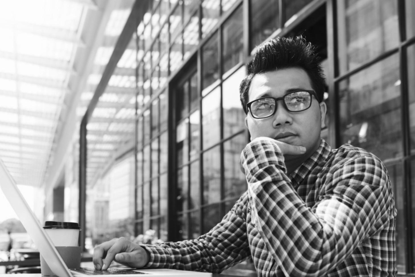 Business professional reviewing automated financial reports and dashboard insights